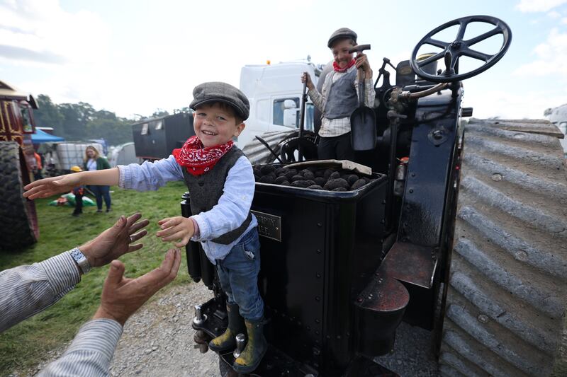 Sean (5) and Timothy (12) and their father Garrett Murphy from Kinsale, Co Cork, with their 1907 Fowler traction engine. Photograph: Nick Bradshaw
