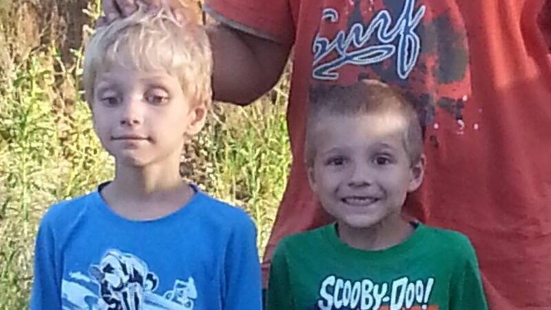 Ethan, left, and Timothy after they were found by farmer Tom Wagner in the remote Expedition National Park, northwest of Brisbane in Australia. Photograph: EPA/Queensland police