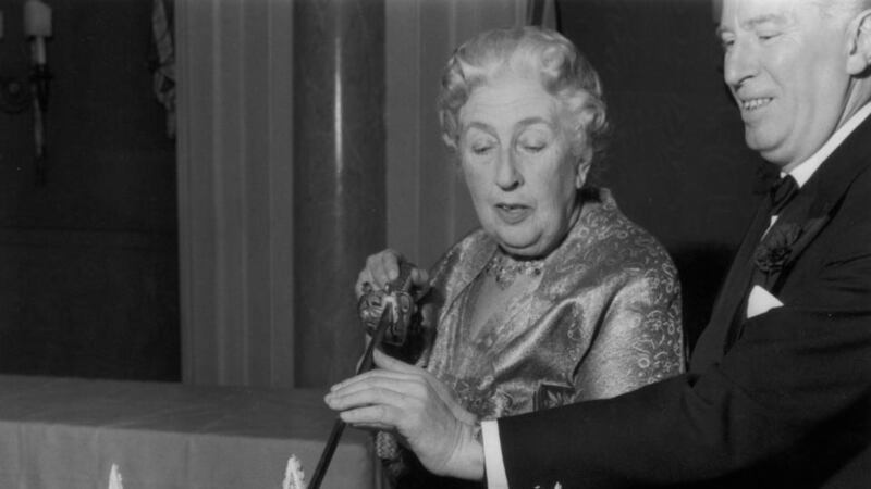 Agatha Christie cuts a cake at a party to celebrate the 10th anniversary of ‘The Mousetrap’. Photograph: Len Trievnor/Express/Getty Image
