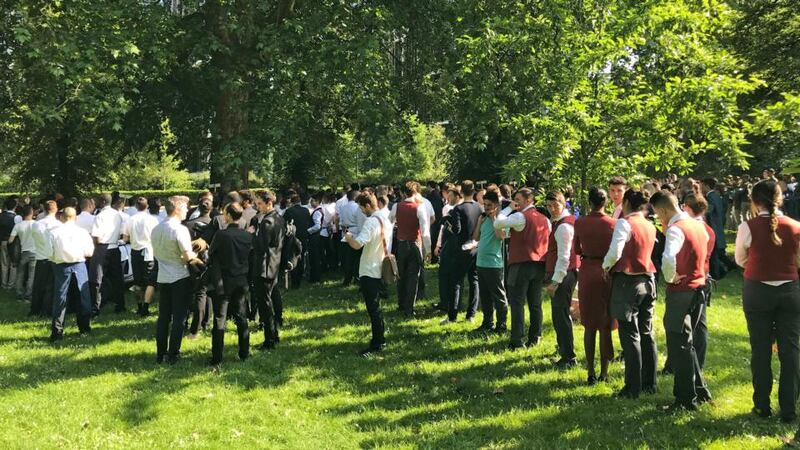 Hotel staff and tradesmen were evacuated to Hyde Park from the Mandarin Oriental hotel in Knightsbridge, central London, during a fire on Wednesday.  Photograph: Sam Blewett/PA Wire