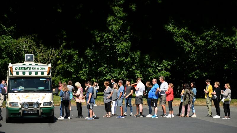 Queueing for ice cream in the sunshine at the Phoenix Park in Dublin. Photograph: Dara Mac Dónaill / The Irish Times