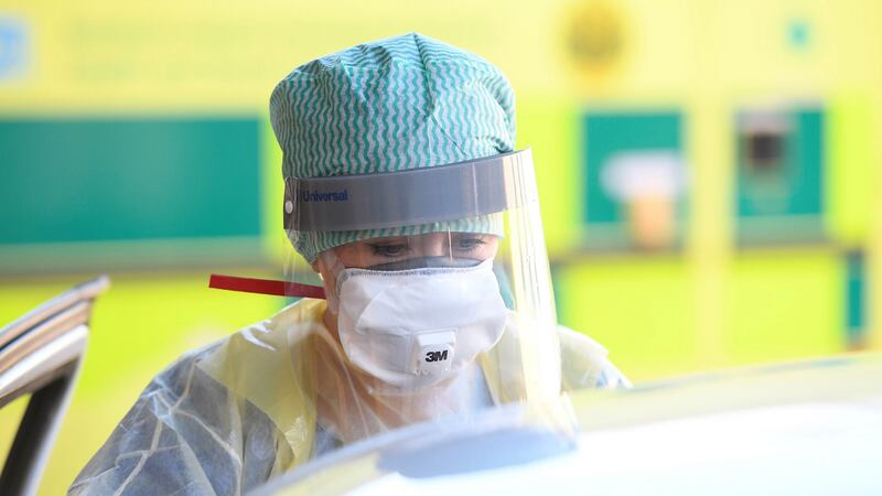 A nurse participates in a demonstration on Wednesday of a coronavirus pod and Covid-19 virus testing procedures set up beside the emergency department of Antrim Area Hospital in Northern Ireland. Photograph: Michael Cooper/PA Wire