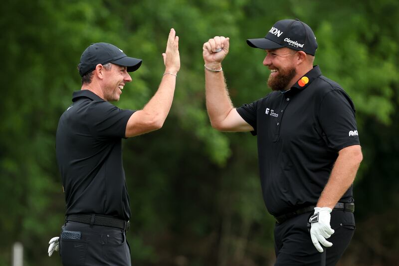 Rory McIlroy and Shane Lowry of Ireland celebrate after a chip shot by Lowry on the 10th green on day one of the Zurich Classic in New Orleans. Photograph: Chris Graythen/Getty Images