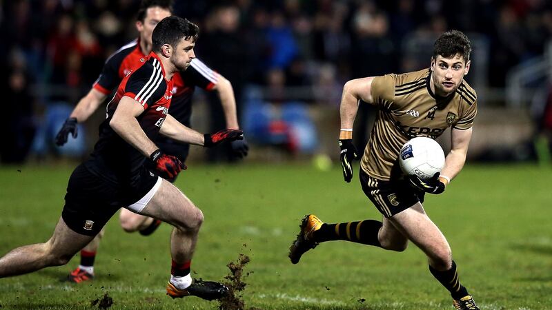 Mayo’s Brendan Harrison with Kerry’s Paul Geaney. Photograph; John McVitty/Inpho