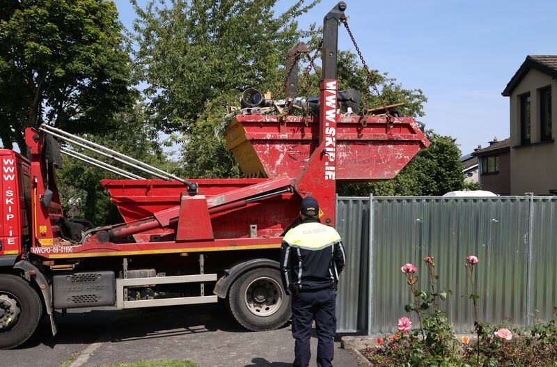 Gardaí remove a skip during their search on a house at Monastery Walk in Clondalkin in the investigation into the murder of Annie McCarrick, who disappeared in 1993. Photograph: Colin Keegan/Collins