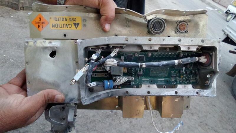 A man holds the remains of what Islamist State members say was a US drone which crashed in Raqqa in Syria today as the United States and several Gulf Arab allies launched air and missile strikes on the militant group’s strongholds. Photograph: Stringer/Reuters.