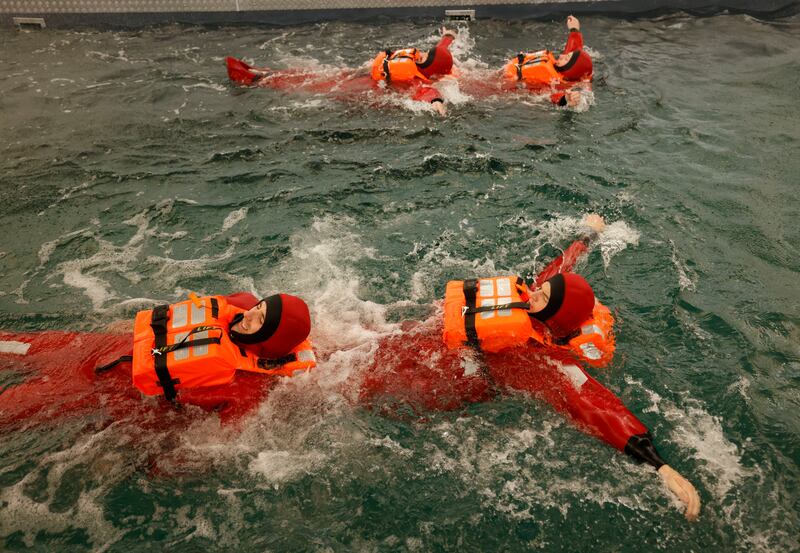Fishers from the MFV Father McKee Pelagic Vessel and Irish Times reporter Katie Mellett undertake the Sea Survival Techniques course at the BIM National Fisheries College at Greencastle, Co Donegal. Photograph: Alan Betson

