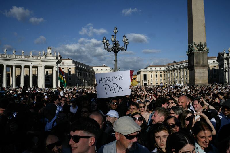 A man holds a placard reading "Habemus Papa" (We Have a Pope) at St Peter's Square after white smoke rose from the chimney of the Sistine Chapel signalling that cardinals elected a new pope. Photograph: Jeff Pachoud/AFP via Getty Images