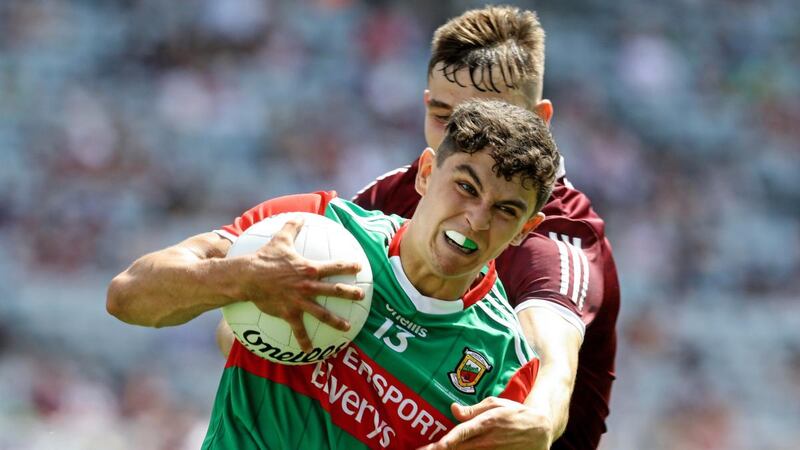 Mayo’s Tommy Conroy is challenged by Matthew Tierney of Galway during the  Connacht SFC Final at Croke Park. Photograph: Lorraine O’Sullivan/Inpho