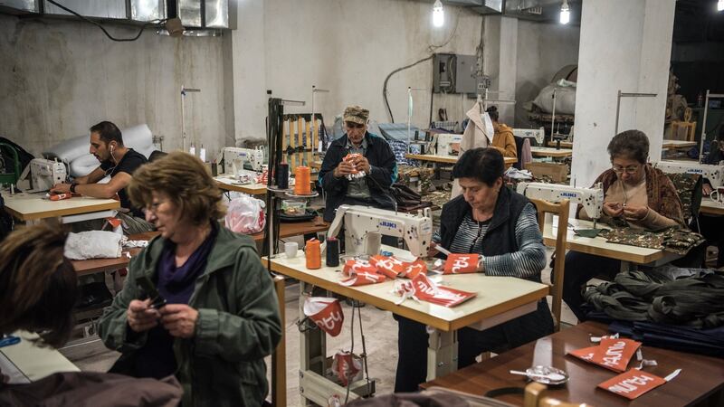 Sewing military uniforms and other supplies in a basement in Stepanakert, Nagorno-Karabakh, on October 15th. Photograph: Sergey Ponomarev/New York Times
