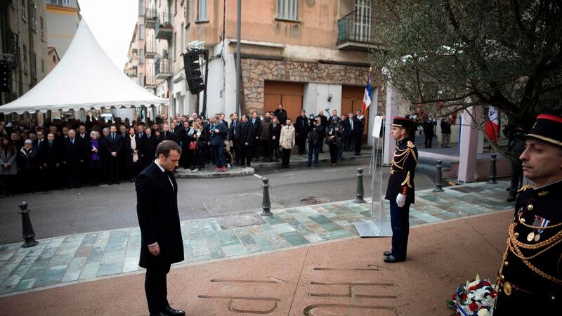 French president Emmanuel Macron pays his respects during the unveiling of a plaque in Ajaccio, Corsica, in tribute to slain French prefect Claude Érignac, who was assassinated 20 years ago in a nationalist attack that shocked the country and brought tens of thousands of Corsicans onto the streets in protest. Photograph:Kamil Zihnioglu/AFP/Getty Images