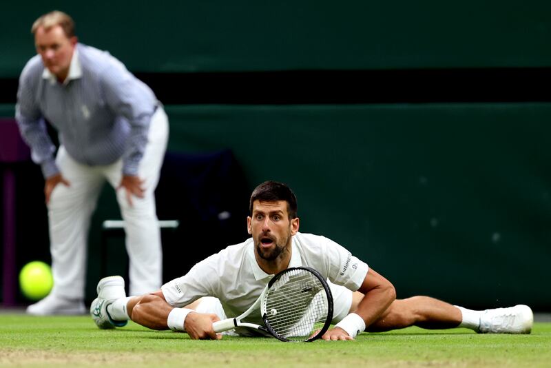 Novak Djokovic of Serbia slips during the men's singles semi-final win over Jannik Sinner of Italy. Photograph: Julian Finney/Getty Images