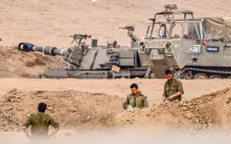 Israeli soldiers prepare for the scenario of ground manoeuvres at an undisclosed location near the border with Gaza, Israel, 29 October 29th. Photograph: Hannibal Hanschke/EPA
