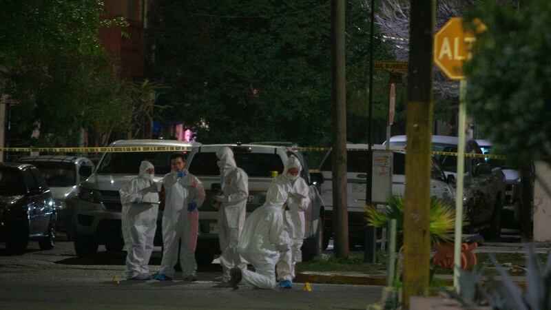 Forensic personnel collect evidence near where nine people were killed in a house while watching a soccer game in Monterrey, Mexico, early today. Photograph: Julio Cesar Aguilar/AFP/Getty Images