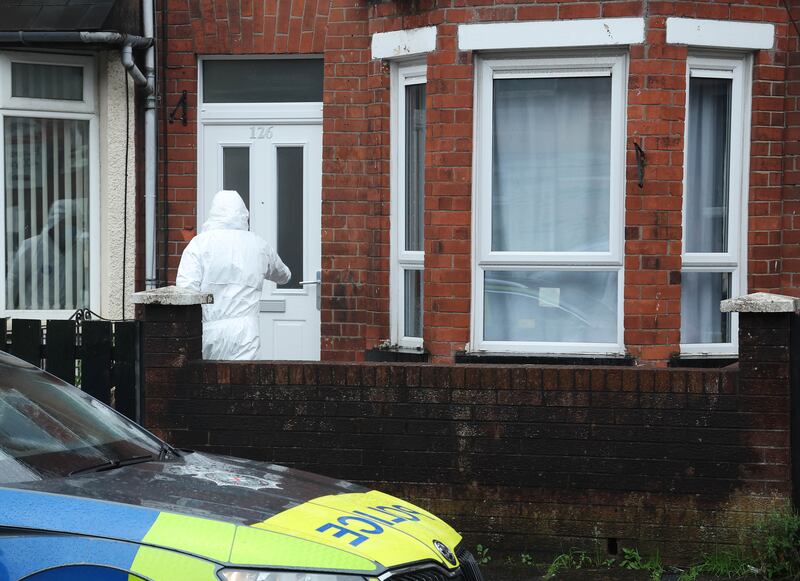 PSNI officers at the scene where Mary Ward's body was found at her home in Melrose Street, Belfast. Photograph: Pacemaker