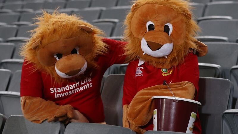 Two people in full lion costumes look disconsolate at the final whistle. Photo: David Rogers/Getty Images