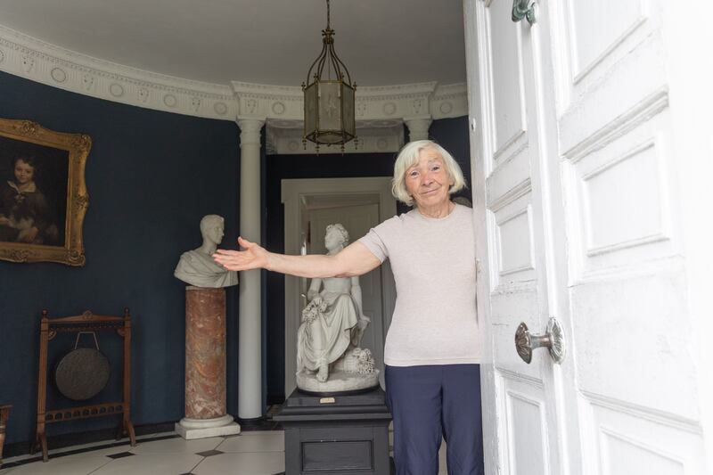 Rita Dooley opens her door at Riverstown House in Glanmire, a classic Irish country house built in 1602 that features work by Italian stuccodores Paolo and Filippo Lafranchini and which has been restored by Rita and her husband Denis
