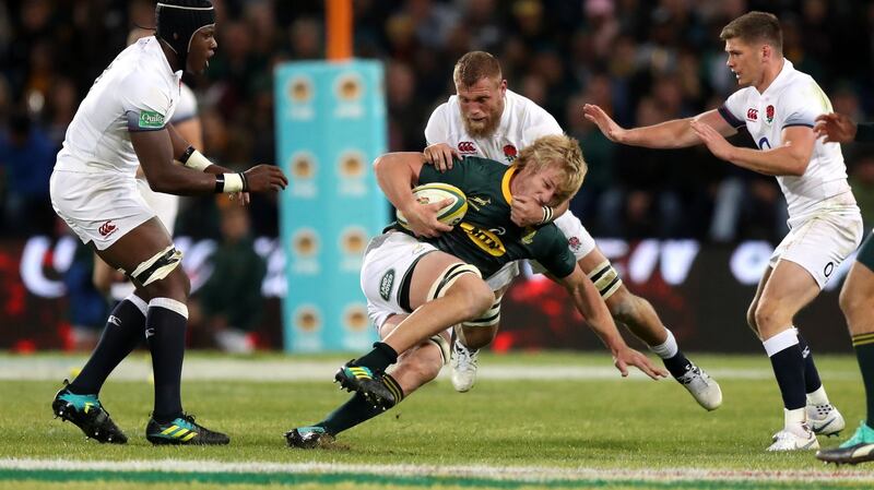 Thomas du Toit of South Africa is held in the tackle by Brad Shields of England during the second test. Photo: David Rogers/Getty Images