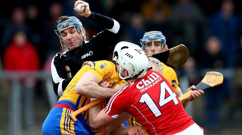 Clare’s goalkeeper Donal Tuohy and Conor Cleary with Patrick Horgan of Cork. Photograph: James Crombie/Inpho