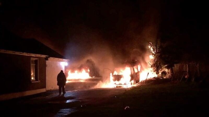 A still from a video on Sunday morning showing vehicles on fire at the house in Falsk. The Democrat Newspaper