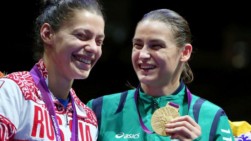 Katie Taylor shares a joke with Sofya Ochigava during the medal ceremony in London. Photograph: Dan Sheridan/Inpho