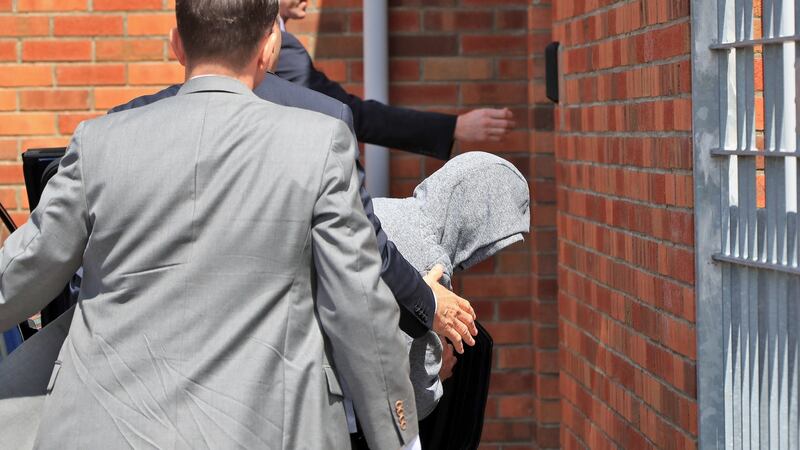 Kieran Greene (32) of Mountain View Park, Rathfarnham (in grey hoodie), being brought into Tallaght District Court this afternoon, where he was charged with the murder of Patricia O’Connor. Photograph: Colin Keegan/Collins Dublin
