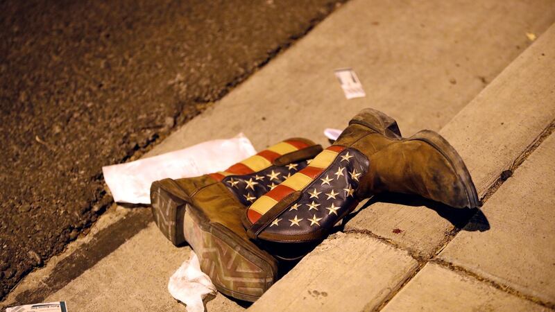 Cowboy boots on the street outside the concert venue. Photograph: Steve Marcus/Las Vegas Sun/Reuters