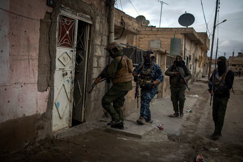 Kurdish special forces conduct searches for escaped prisoners and Islamic State fighters in Hasaka, Syria, in January 2022.  Photograph: Diego Ibarra Sanchez/New York Times