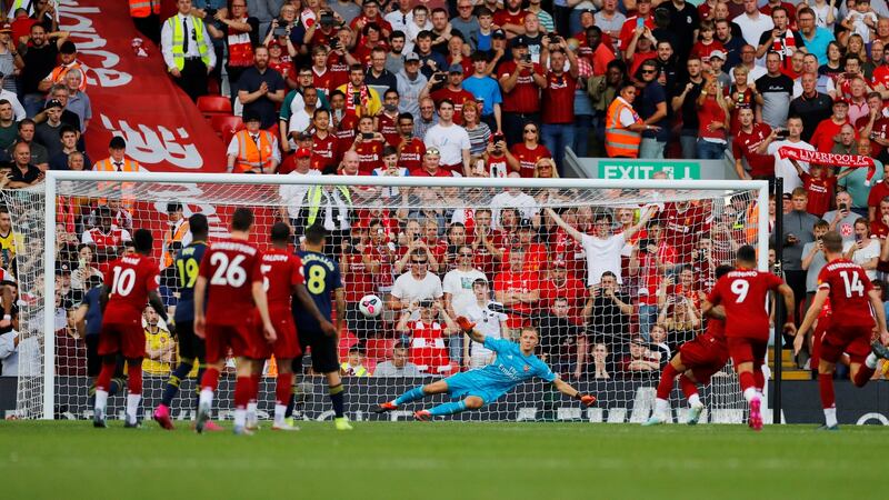 Mohamed Salah scores from the penalty spot at Anfield. Photograph: Phil Noble/Reuters