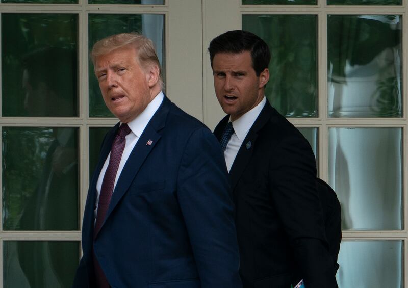 Donald Trump with John McEntee: 'Johnny understands people,' said Trump. 'He understands loyalty.' Photograph: Andrew Caballero-Reynolds/AFP/Getty Images