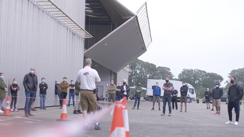 The crew is briefed about Covid-19 measures before the shoot begins