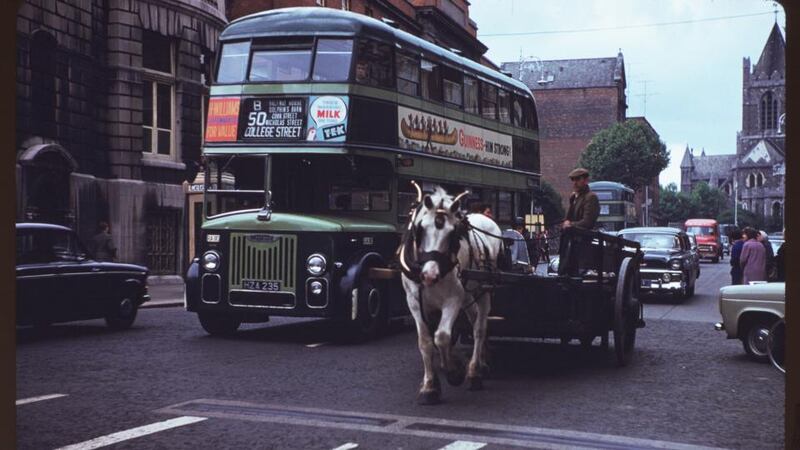 A one-horse dray beside a Dublin city bus in Dame Street. Photograph: Charles Cushman: From the University of Indiana Collection .