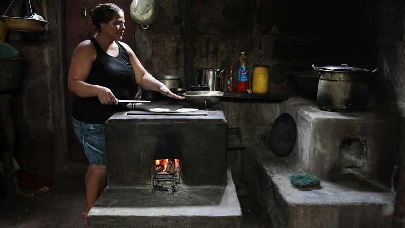 Eusebia Campos cooks tortillas on a fuel-efficient stove. Photograph: Oswaldo Rivas