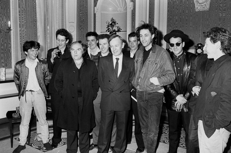 Pop stars fronted by Bob Geldof at the Irish Embassy in London to give details to Ireland's ambassador Noel Dorr, about Self Aid, a 12-hour concert in Dublin to focus on the country's unemployment problems. From left: Pete Briquette (Boomtown Rats), Shane MacGowan (The Pogues), Van Morrison, Spider Stacey, Jem Finer (both Pogues), Noel Dorr, James Fearnley (The Pogues), Bob Geldof, Elvis Costello, Cait O'Riodian (Pogues, hidden) and Paul Brady. Photograph: PA