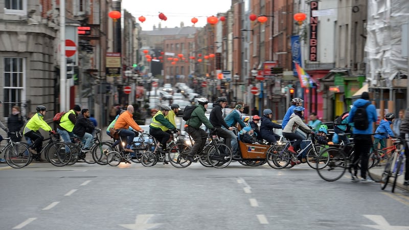 The  Dublin Cycling Campaign protesters pass by Capel Street along the Liffey quays on Sunday morning. Photograph: Alan Betson