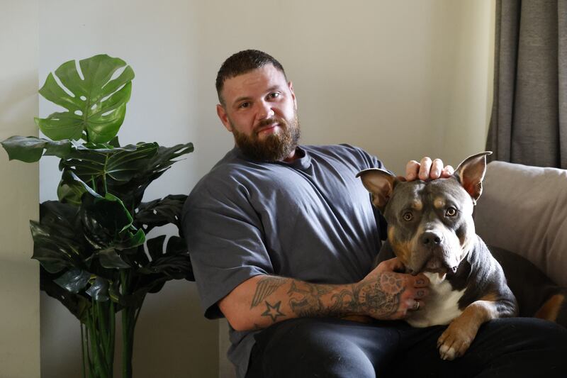 XL bully: Rowan Woodgates with his 3 year old dog Goose. Photograph : Nick Bradshaw