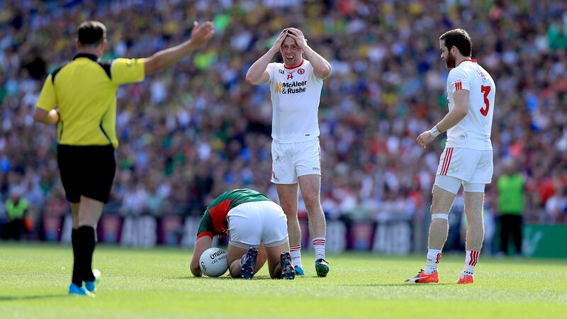 Tyrone’s Sean Cavanagh is sent off for a challenge on Mayo’s Aidan O’Shea (second yellow). Photo: Donall Farmer/Inpho