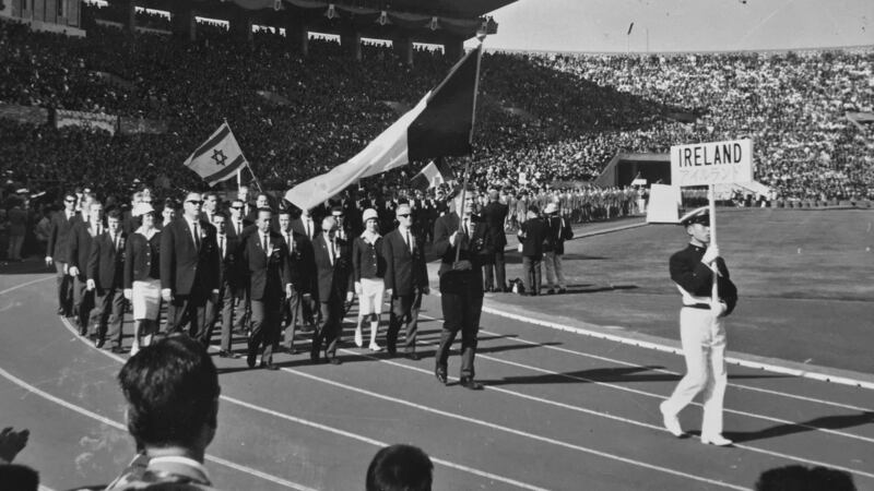 The Irish team of 25 athletes, including friends Basil Clifford and Tom O’Riordan, march behind the national flag at the Tokyo Olympics in 1964.