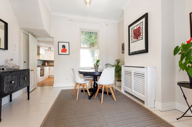 Garden level is laid out with a livingroom to the front leading into a diningroom, above.