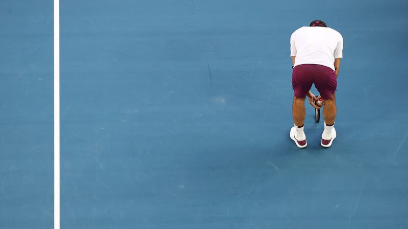 Federer struggled with a back injury the whole way through. Photo: David Gray/Getty Images