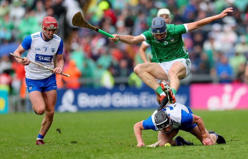 Limerick’s David Reidy and Kevin Mahony of Waterford in action at the Gaelic Grounds. Photograph: James Crombie/Inpho