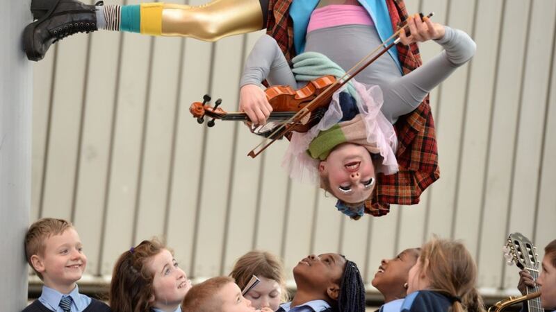 Paper Dolls, aerial artist Emily Aoibheann joined up-and-coming musicians and students from Devine Mercy Junior National School, Lucan as Dublin's newest festival, MusicTown 2015 unveiled its programme. Photograph: Dara Mac Dónaill