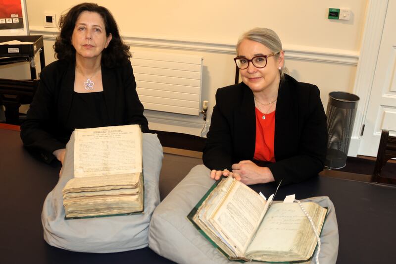 National Library keeper of special collections Colette O'Flaherty and director Dr Audrey Whitty with bound volumes of Richard Robert Madden's correspondence. Photograph: Ronan McGreevy