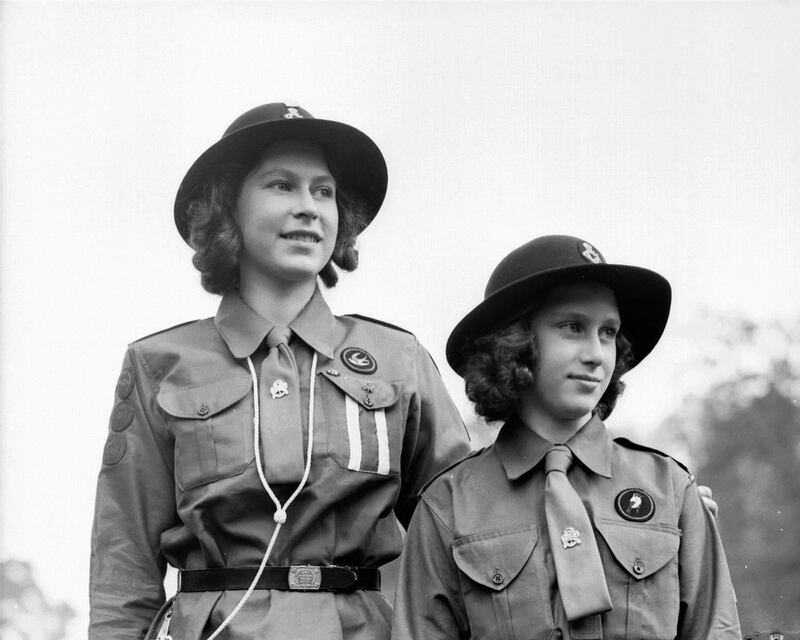 Princesses Elizabeth (left) and Margaret Rose (1930 - 2002) wearing Girl Guide uniforms at Frogmore, Windsor, Berkshire on June 30th, 1942: Photograph: Lisa Sheridan/Studio Lisa/Getty Images