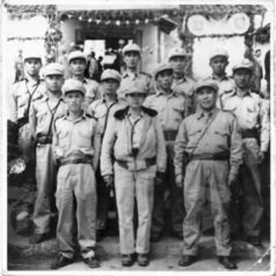A handout photo of Olive Yang, centre, with her soldiers, circa 1956