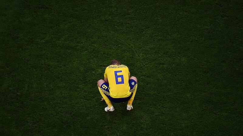Sweden’s defender Ludwig Augustinsson reacts after their defeat. Photograph: Getty Images