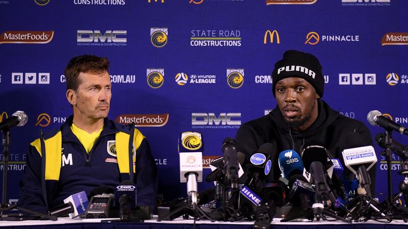 Usain Bolt with Central Coast Mariners boss Mike Mulvey. Photograph: Dan Himbrechts/EPA