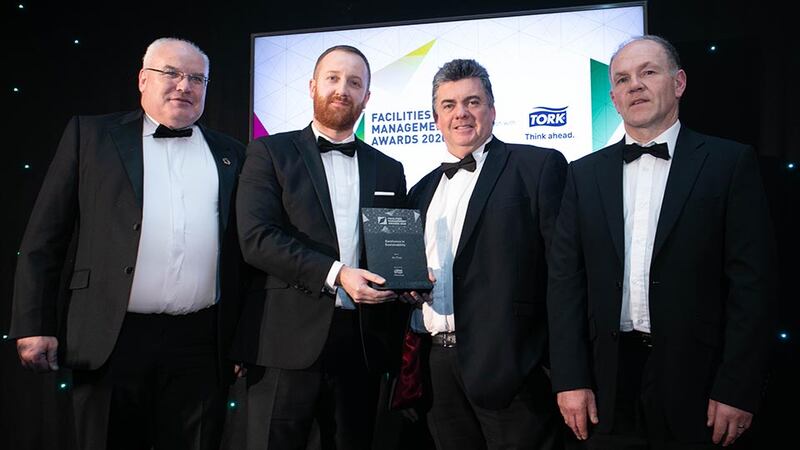 Barry Scully, Account Manager, Tork®, an Essity brand presents the Excellence in Sustainability award to the An Post Facilities team.