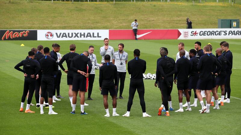 England assistant coach Steve Holland speaks to the players while manager Gareth Southgate looks on during a training session at St George’s Park, Burton. . Photograph: Nick Potts/PA Wire.