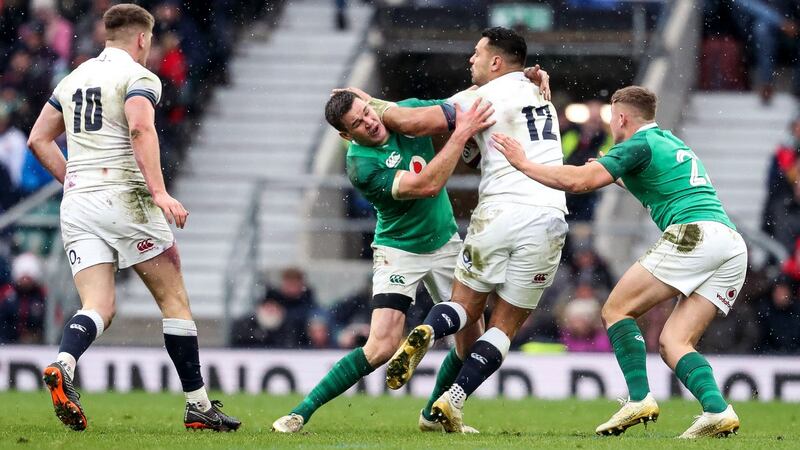 Ireland’s Johnny Sexton and Jordan Larmour tackle England’s Ben T’eo at the NatWest Six Nations Championship match in Twickenham.  Photograph: Dan Sheridan/Inpho